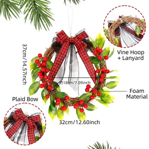 Christmas wreath with red berries, pine leaves, and checkered bow on rattan base