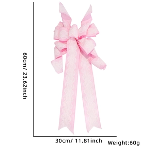 Pink handmade Christmas bow with lace edges for festive home party decoration