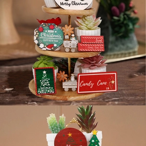 Detailed Christmas tiered tray decor set with wooden signs, festive ornaments and greenery