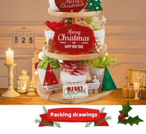 Macro detail of Christmas tiered wood tray set with festive ornaments and ceramic planters