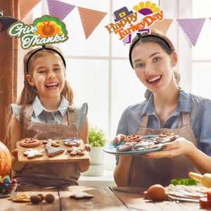 Women and child wearing Thanksgiving turkey headbands with Give Thanks motifs in kitchen
