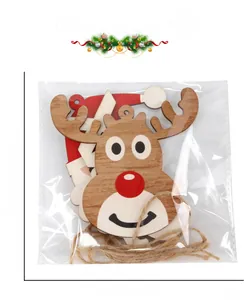 Detailed view of wooden Christmas reindeer and Santa ornaments with natural jute twine