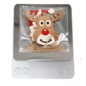 Christmas wooden reindeer and Santa ornaments on scale showing 20g lightweight quality