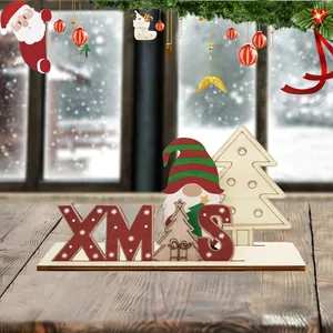 Detail of wooden XMAS letter sign with a festive gnome and tree on a rustic timber base