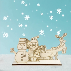 Detailed laser-cut Christmas wooden snowman and reindeer figurines on a blue background