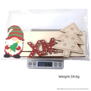 Three-piece wooden Christmas decor set including gnome and XM letters on a digital scale