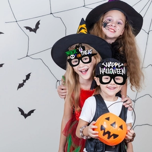 Kids wearing LED Halloween glasses with Trick or Treat and Happy Halloween glowing patterns