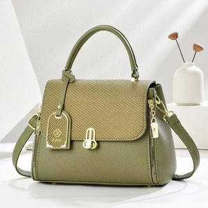 Grass green leather crossbody bag with woven flap and rabbit-shaped gold twist lock