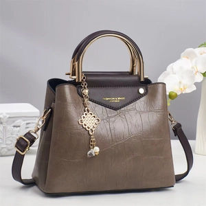 Brown crocodile texture handbag with gold metal handle and long shoulder strap