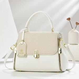 Detail of white lychee leather and beige woven fabric textures with gold CD buckle