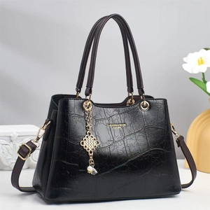 Elegant black crocodile texture tote bag with golden hardware and long shoulder strap