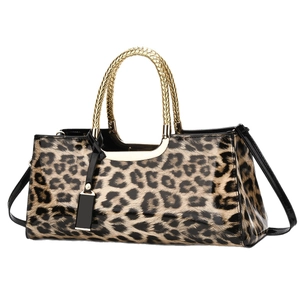 Fashionable leopard print handbag with golden circular handles and black shoulder strap