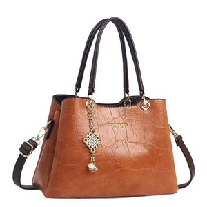 Brown crocodile embossed tote bag with gold hardware and pearl charm detail