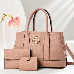 Three-piece women's tote bag set with crocodile texture and gold logo in rose pink