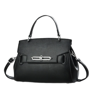 Black pebbled leather bucket bag with silver metal lock and adjustable shoulder strap