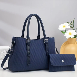 Deep blue Saffiano leather tote bag and matching envelope clutch in a stylish set
