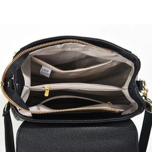 Top view of black lychee grain shoulder bag with triple compartments and golden zippers