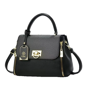 Premium black sheepskin leather tote bag with woven flap and gold hardware lock