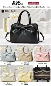 Detail of woven texture handbag with bow decoration showing multiple color options