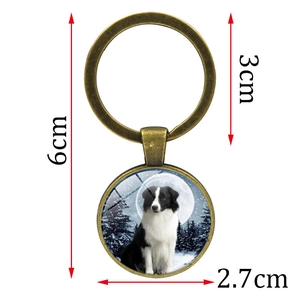 Vintage bronze keychain with border collie dog glass pendant and forest background