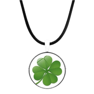 Detail of silver clover pendant with green four-leaf motif and black cord necklace
