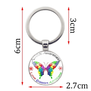 Silver autism awareness butterfly keychain with puzzle pattern and love support text