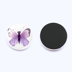 Detailed view of 25mm purple butterfly glass magnet with a black magnetic backing