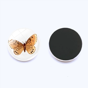 25mm glass refrigerator magnet featuring a realistic brown butterfly design on white background
