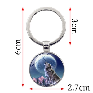 Wolf howling at the moon glass pendant keychain with dimensions shown on white background