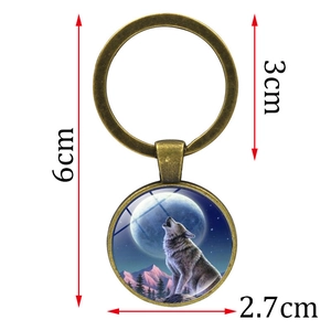 Antique bronze wolf and moon glass cabochon keychain with dimensional measurements