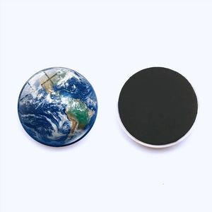 Detail of Earth glass fridge magnet with glossy dome finish and magnetic backing