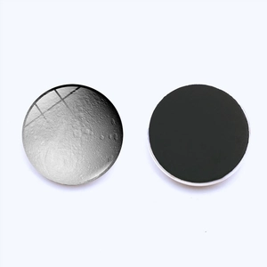 Detail of 25mm moon planet glass fridge magnet showing front texture and back magnetic layer