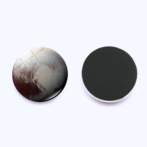 Detail view of Pluto celestial fridge magnet showing planetary surface and magnetic back