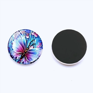 Detailed view of round glass fridge magnets featuring colorful butterfly motifs and magnetic back