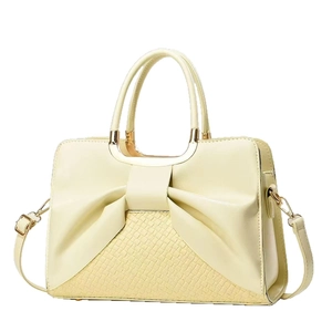 Elegante borsa a mano giallo crema con fiocco, trama coccodrillo e tracolla regolabile