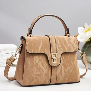 Elegant tan faux leather handbag with marble texture and gold twist-lock for women