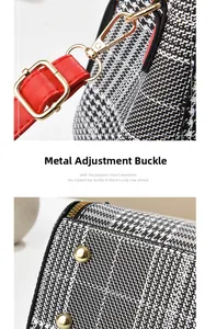 Detail of gold hardware clasp and red pebble leather strap on houndstooth handbag