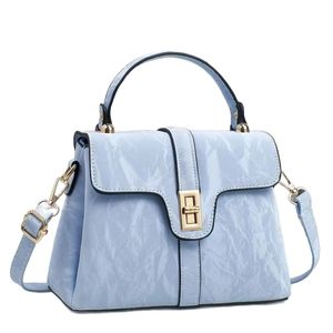 Pale blue wrinkled patent leather tote bag with gold twist lock and adjustable shoulder strap