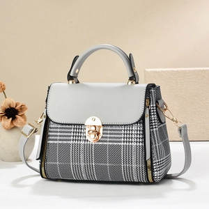 Classic houndstooth plaid Kelly bag with grey leather accents and gold buckle