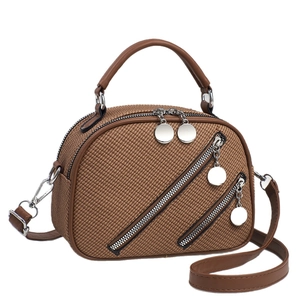 Deep brown woven leather handbag with dual metal zippers and adjustable shoulder strap