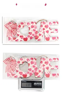 LOVE sign door hanger with heart patterns showing dimensions 33x15cm and 63g weight