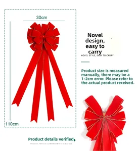 Detail of a large 30cm by 110cm red velvet Christmas bow with gold trim and size dimensions