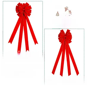 Detailed view of red velvet Christmas bows with gold wire edges for tree decoration