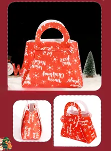 Detail of red felt Christmas candy bag with snowflake prints and built-in handle