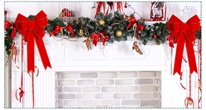 Detail of red velvet Christmas bows with gold edges on a festive fireplace mantel
