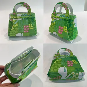 Detail views of Easter bunny non-woven gift bag with carrot and floral prints