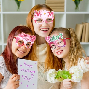 Adult and children wearing floral Mother's Day party glasses with Best Mom and MOM text