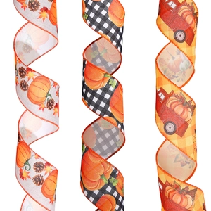Detailed texture of autumn ribbons featuring pumpkins, maple leaves, and vintage trucks