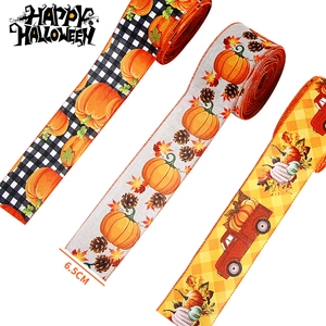 Detailed view of 6.3cm Halloween ribbons with pumpkin and truck festive patterns