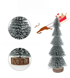 Miniature snow-dusted Christmas tree with detailed needle texture and natural log base